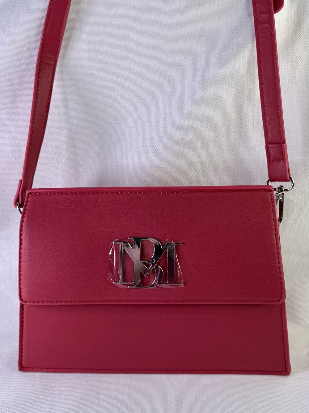 Red Monogram lined Crossbody Bag by Badgley Mischka.